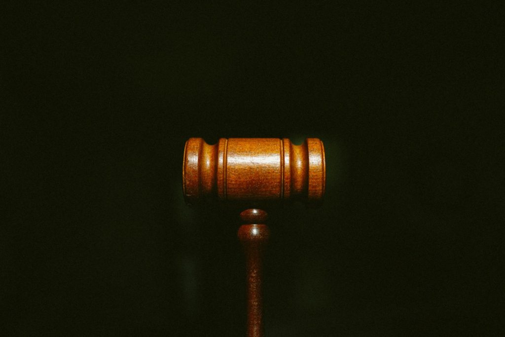 brown wooden stand with black background